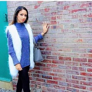 White fur vest